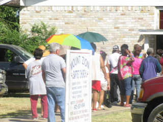 Sandbranch residents in line outside Mount Zion Baptist Church to get food and waterEugene Keahey
